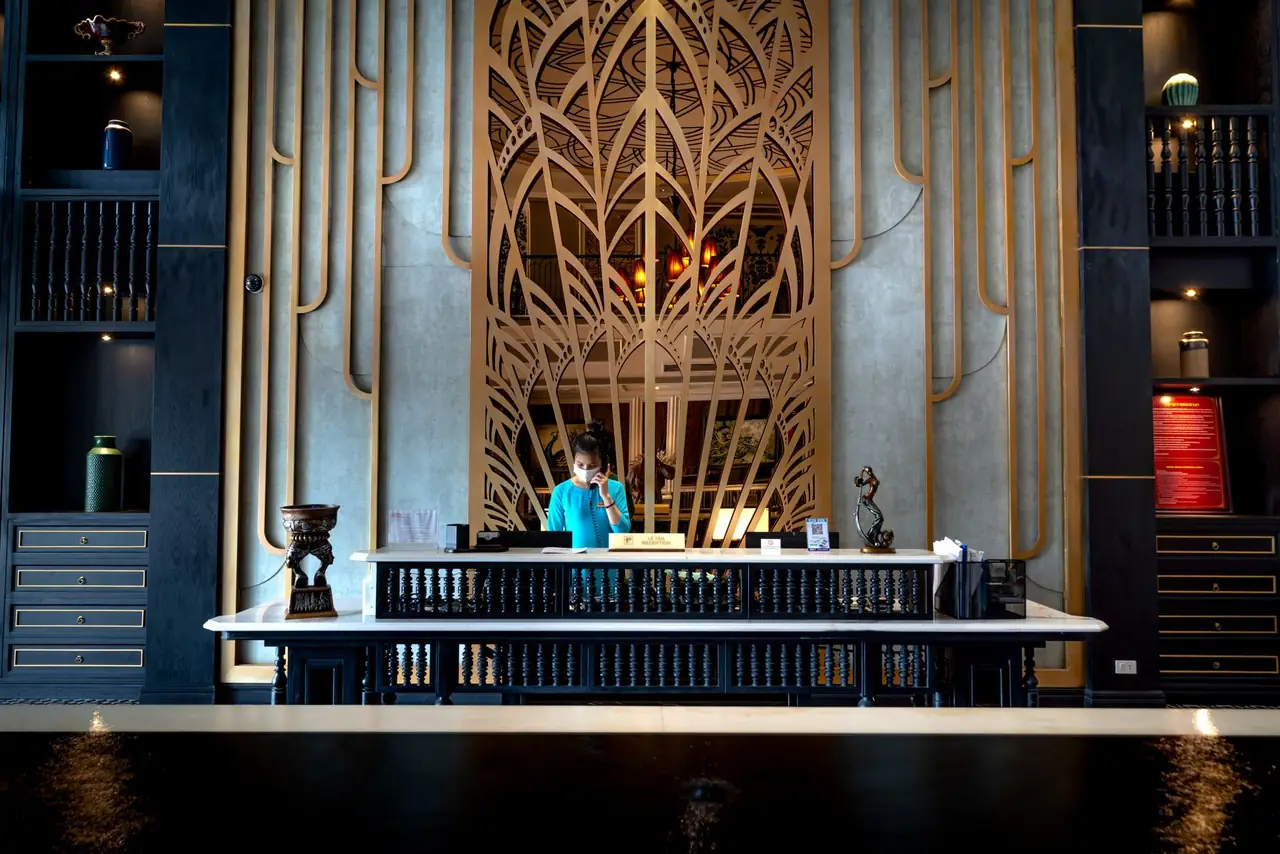 Reception desk and seating in a hotel lobby